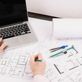 architecture-concept-with-building-plan-laptop_23-2147813061